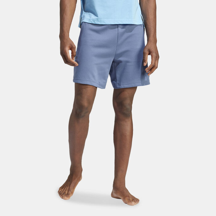 Man wearing lightweight blue adidas training shorts designed for movement, comfort, and warm-weather workouts