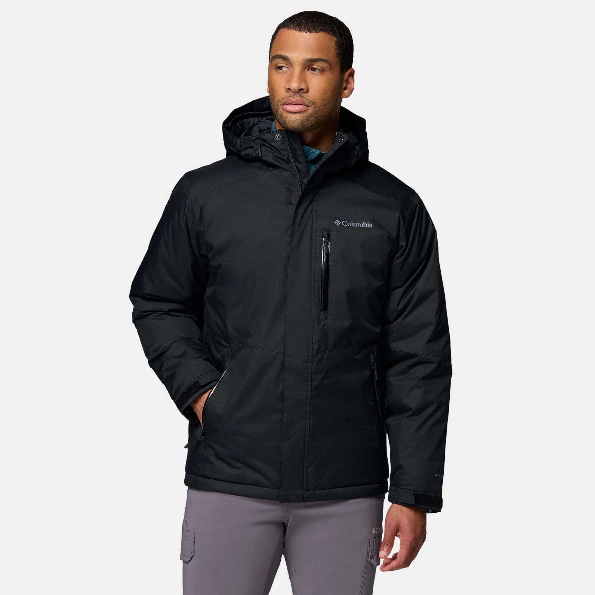 Columbia men’s black insulated jacket with hood, zip pockets, and clean outdoor-style design.