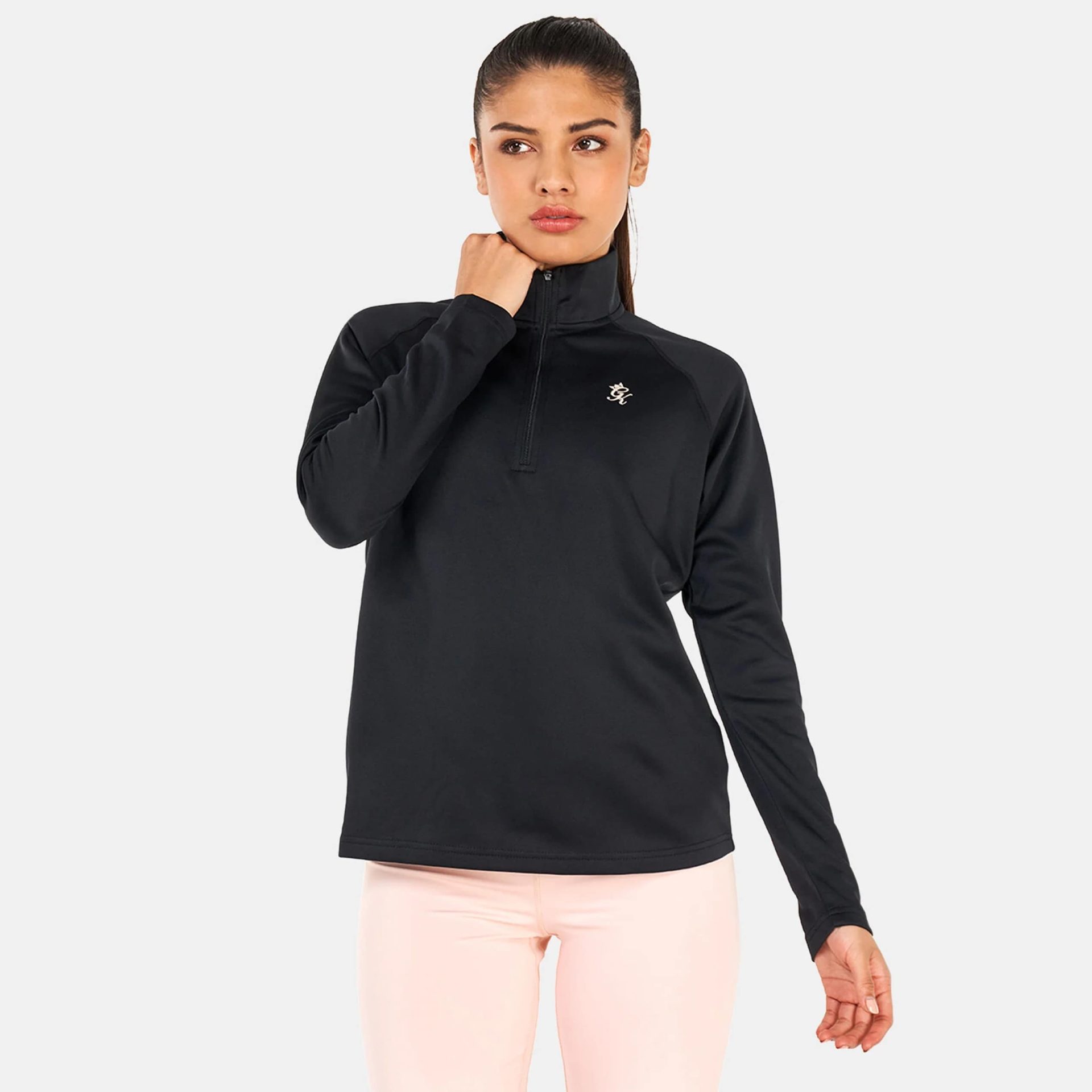 Gym King women’s black 1/4 zip long-sleeve top with fitted silhouette and minimal branding.